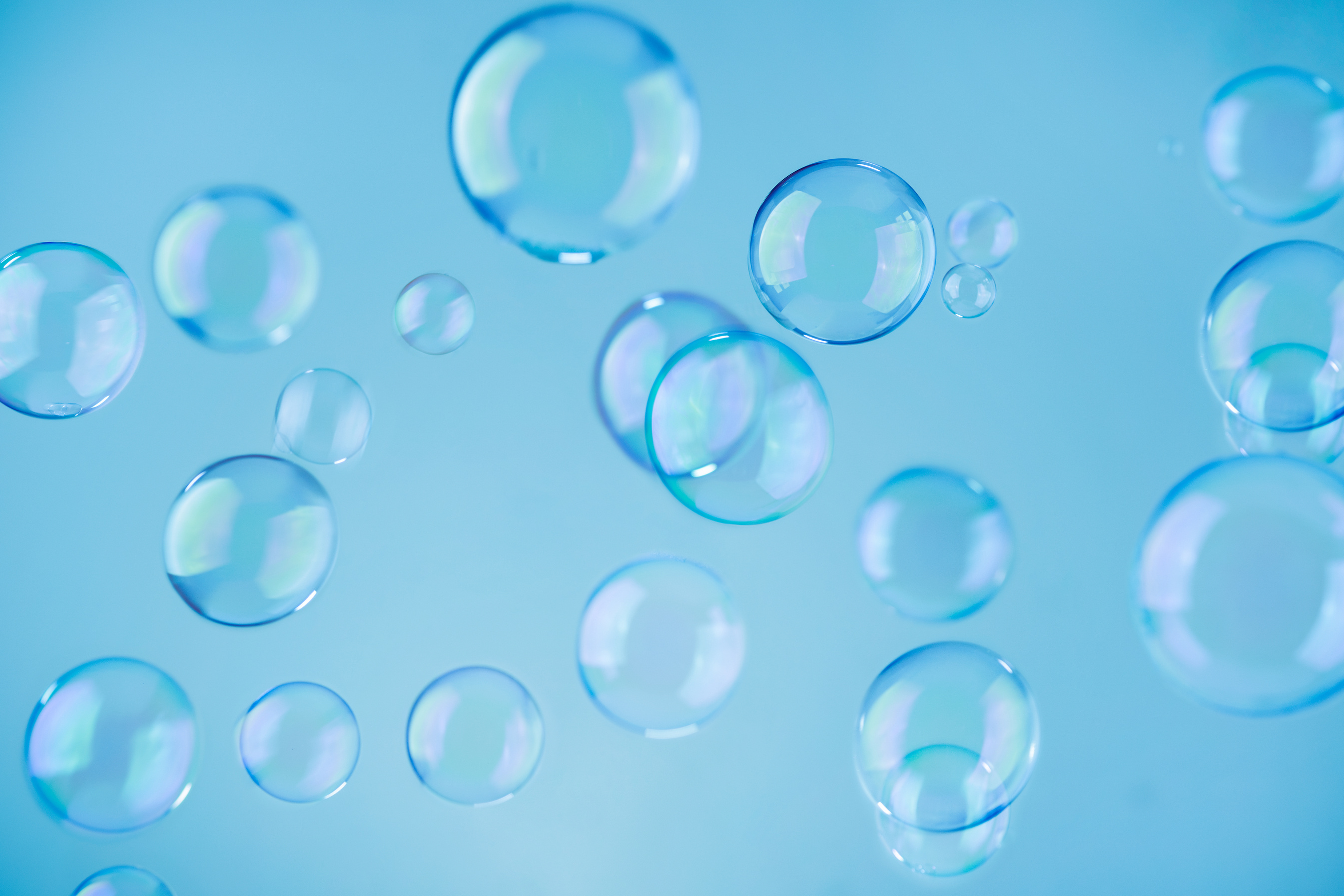 Abstract blue soap bubbles background. Blue soap bubbles wallpap